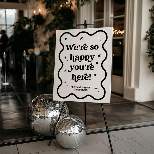 We're So Happy You're Here Black and White Retro Welcome Sign